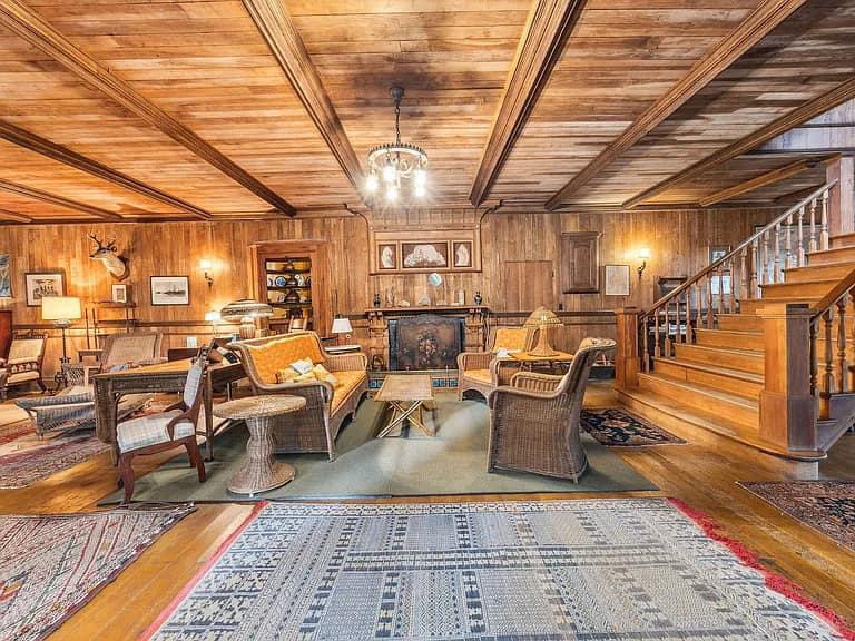 Keene Valley NY house with wood walls and impressive all wood vintage living room with mission style furniture