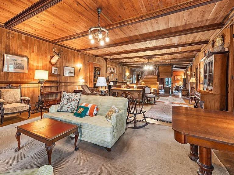 Keene Valley NY house with wood walls and impressive all wood vintage living room with Adirondacks style furniture