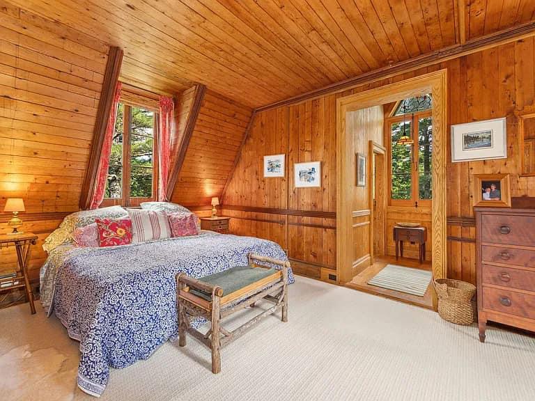 Keene Valley NY house with wood walls and ceilings and log cabin master bedroom