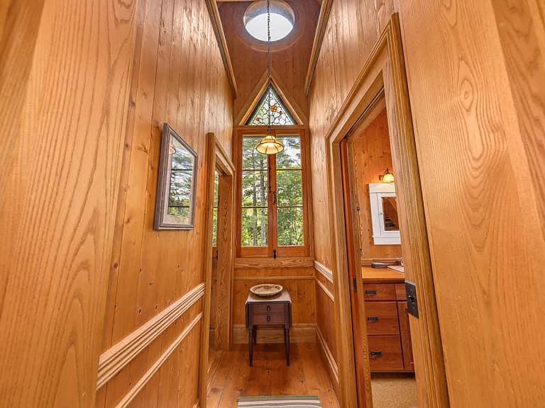 Keene Valley NY house with wood walls and long narrow hallway