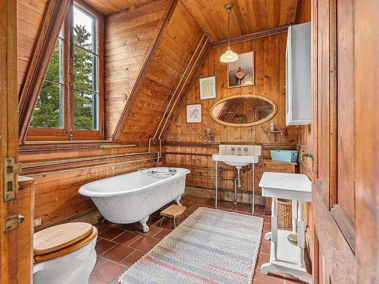 Keene Valley NY house with wood walls and ceilings and clawfoot antique white tub