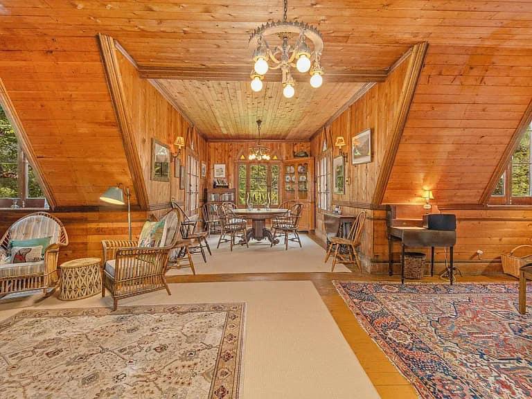 Keene Valley NY house with wood walls and impressive all wood vintage living room with Adirondacks style furniture