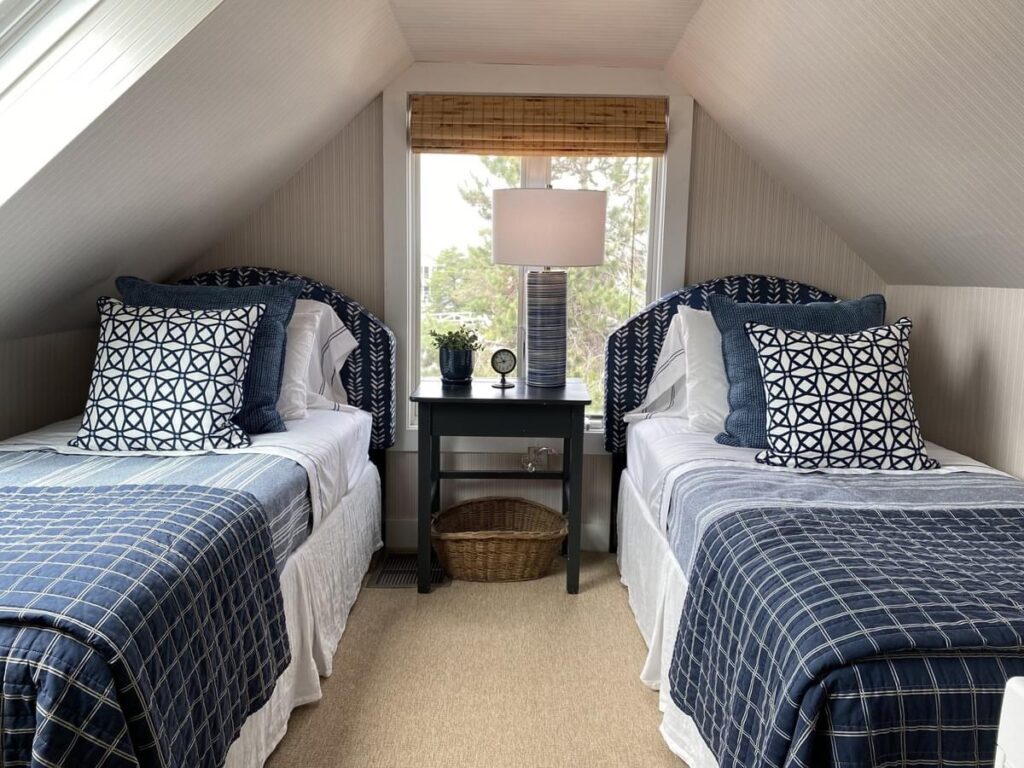 light bright rooms, modern navy blue and cream coastal decor attic bedroom with window and twin beds