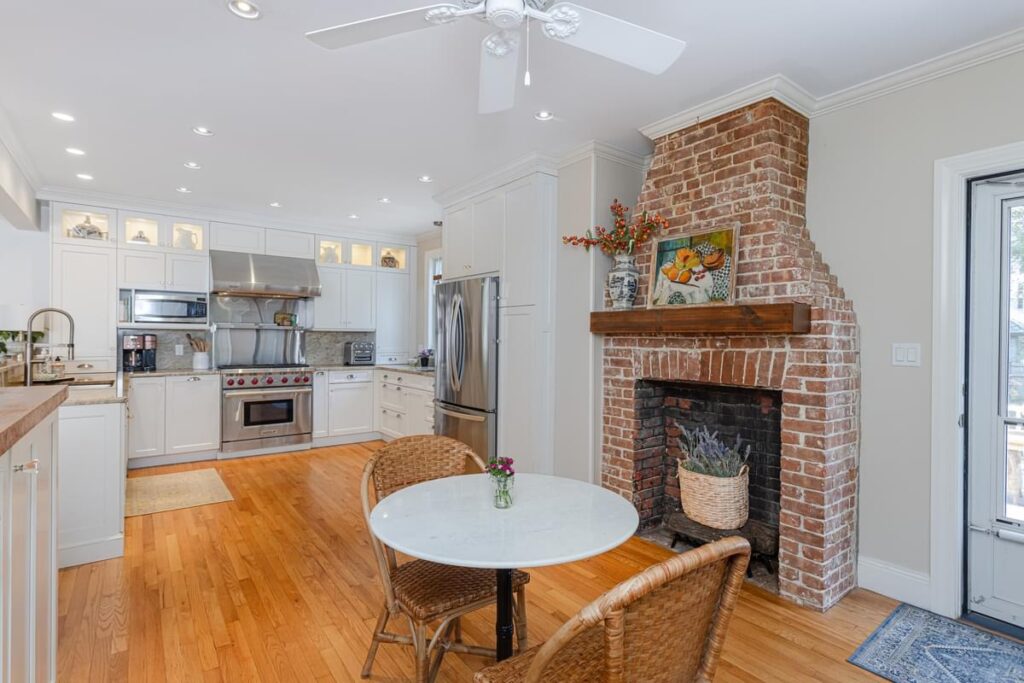 light bright rooms, modern navy blue and cream coastal decor kitchen with exposed brick fireplace