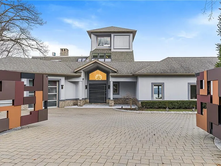 Modern Nyack, NY Palace with windows overlooking the hudson river with steel guard gates