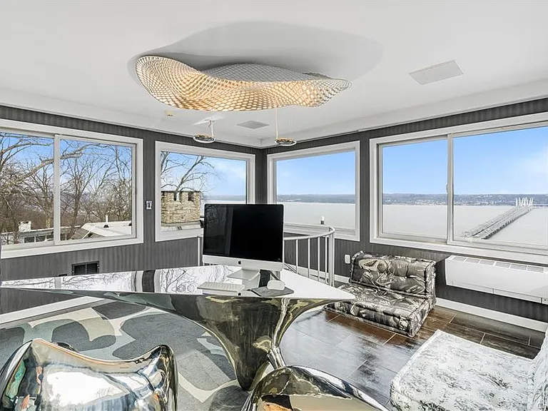 Modern Nyack, NY Palace with windows overlooking the hudson river, sleek modern home office overlooking the Hudson