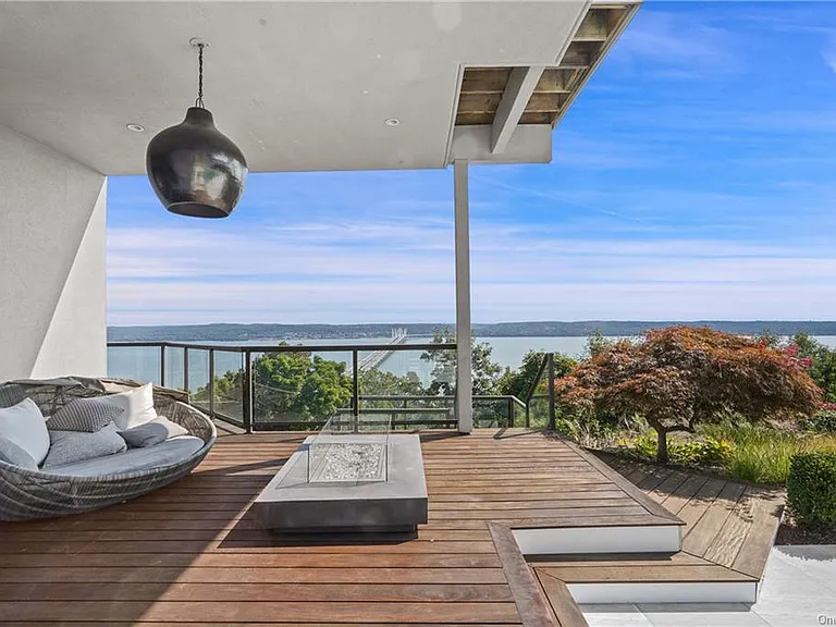 Modern Nyack, NY Palace with windows overlooking the hudson river, sleek modern deck overlooking the Hudson River facing east