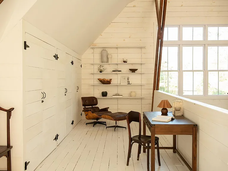 converted dairy barn in accord ny, modern country home office with natural light around built-ins and vaulted ceilings