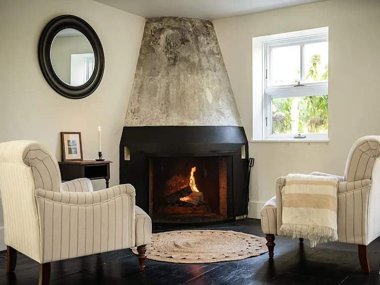 converted dairy barn in accord ny, modern country fireplace and den with natural light