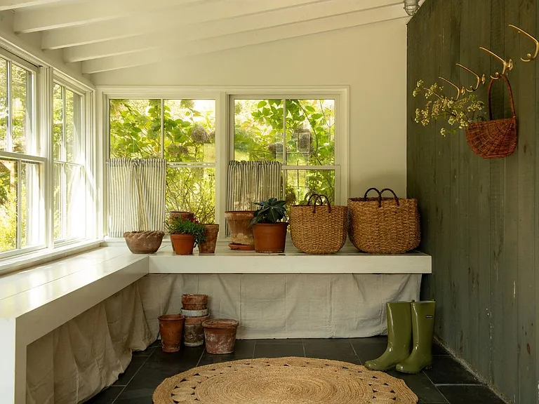 converted dairy barn in accord ny, modern country sun room with plants