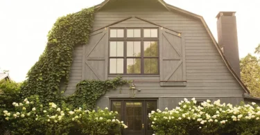 converted dairy barn in accord ny with english countryside design and green ivy and white hydrangeas