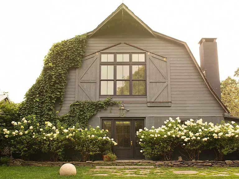 converted dairy barn in accord ny with english countryside design and green ivy and white hydrangeas