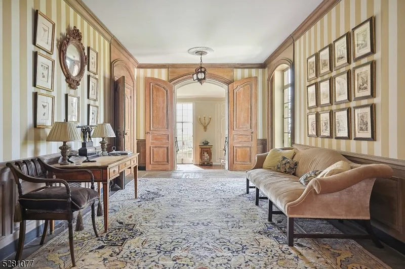 massive NJ castle in chester township listed for $4 million, french country sitting room with velvet furniture and wooden double doors