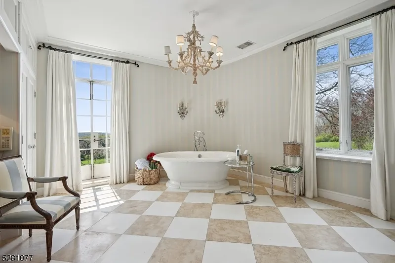 massive NJ castle in chester township listed for $4 million, french country bathroom with elegant tub and gold hardware