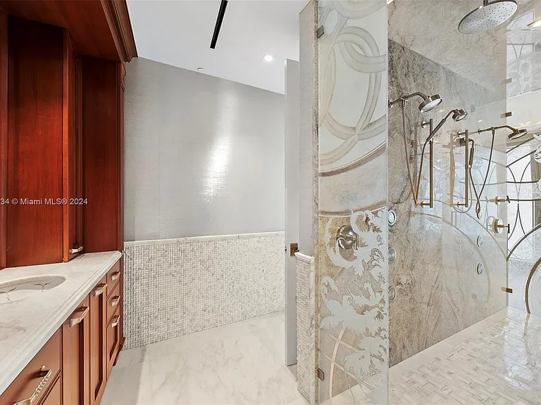 Fort Lauderdale Beach Penthouse, entrance to master bathroom with soft marble finishes and walk in closet