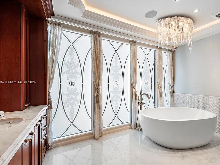 Fort Lauderdale Beach Penthouse, entrance to master bathroom with wood dressing room and large porcelain soaking tub