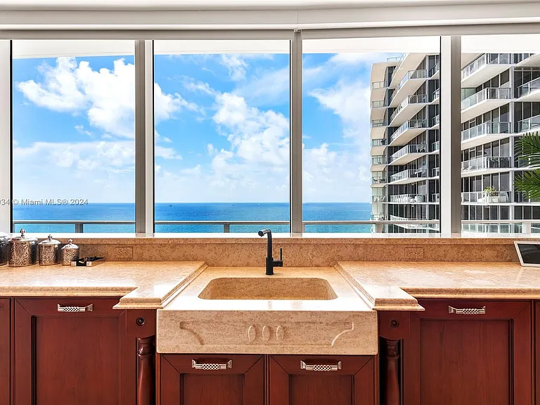 Fort Lauderdale Beach Penthouse, large kitchen overlooking the atlantic ocean with marble farmhouse sink