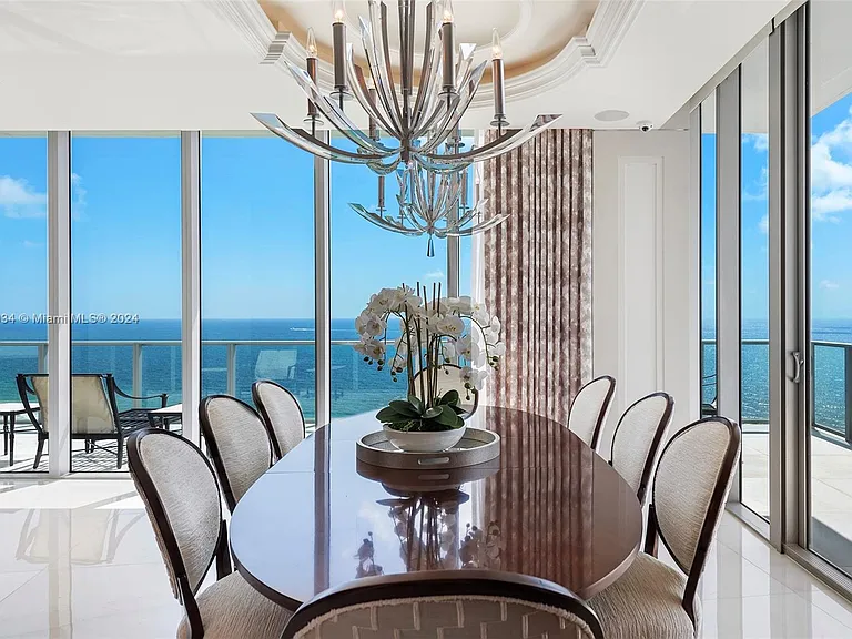 Fort Lauderdale Beach Penthouse, large modern dining room with chandelier overlooking the atlantic ocean