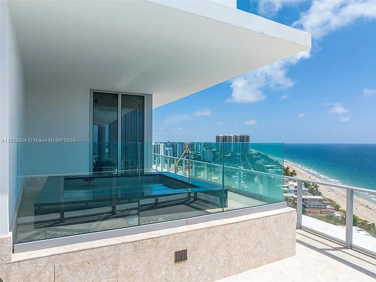 Fort Lauderdale Beach Penthouse, large modern glass building overlooking the atlantic ocean in broward county with build in balcony hot tub