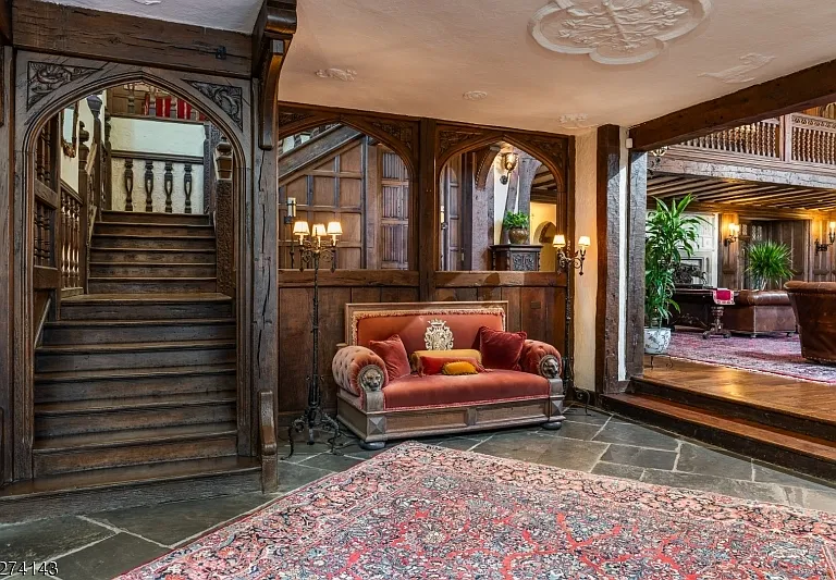 tudor style castle in NJ, large fireplace and tudor fireplace and exposed  dark wood beams at Glynallyn in Morris Township