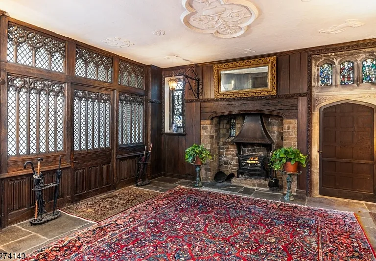 tudor style castle in NJ, large fireplace and tudor fireplace and exposed  dark wood beams at Glynallyn in Morris Township