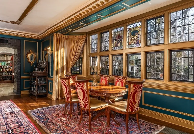 tudor style castle in NJ, breakfast nook with antique breakfast table and lots of natural light