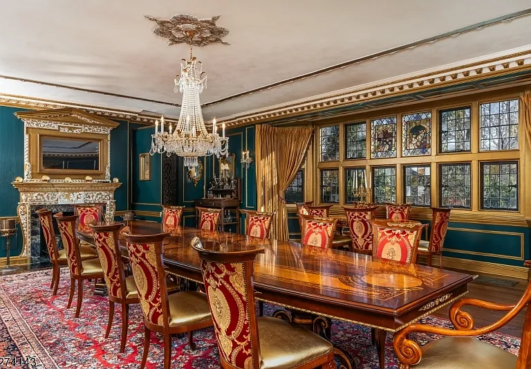 tudor style castle in NJ, large dining room with massive wood dining table and architectural details