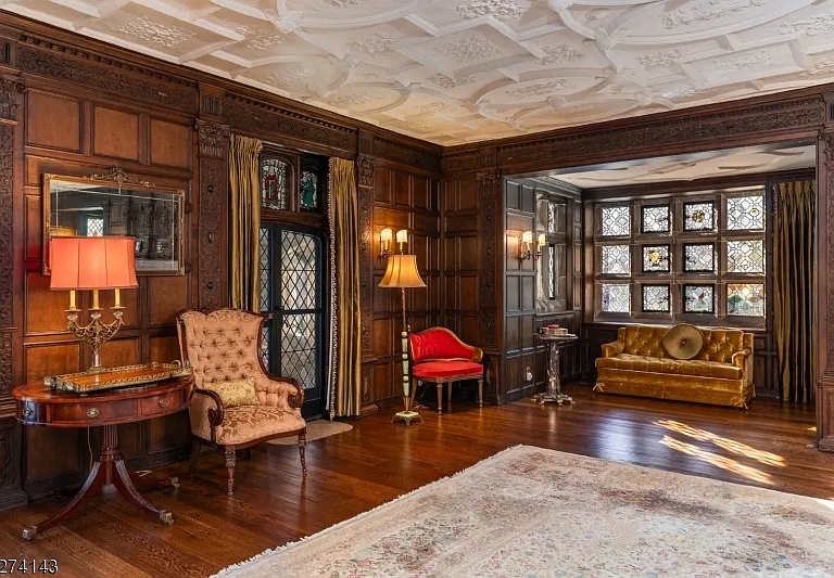 tudor style castle in NJ, antique dark wood sitting room with vintage furniture