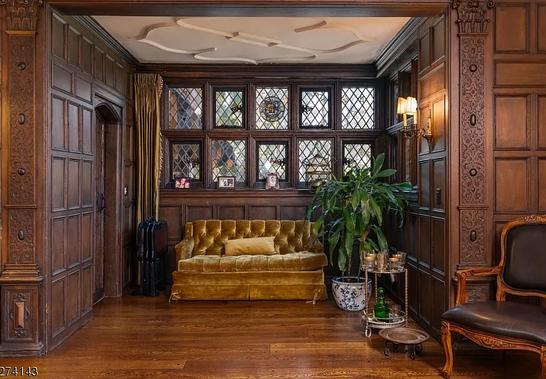 tudor style castle in NJ, antique dark wood sitting room with vintage furniture