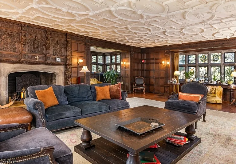 tudor style castle in NJ, antique dark wood sitting room with vintage furniture