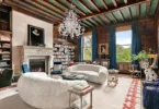 fifth ave nyc mansion listed for $58 million, interior of 973 fifth avenue with 16 foot ceilings and wood beams