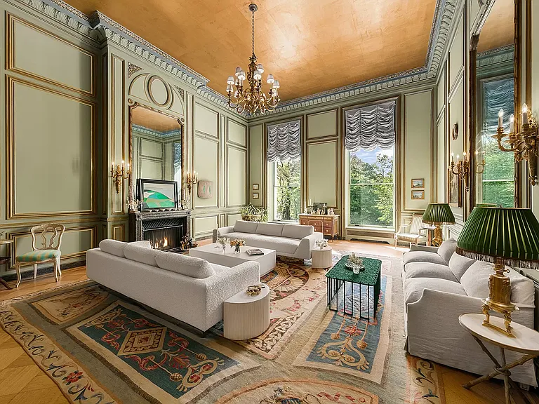 fifth ave nyc mansion listed for $58 million, exterior of 973 fifth avenue with massive rood deck facing central parkfifth ave nyc mansion listed for $58 million, interior of 973 fifth avenue with sun-lit sitting rooms and entertaining spaces