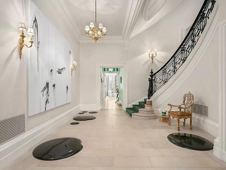 fifth ave nyc mansion listed for $58 million, interior of 973 fifth avenue with massive marble entryway