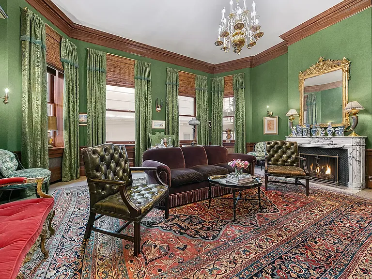 fifth ave nyc mansion listed for $58 million, interior of 973 fifth avenue with massive classic green sitting room