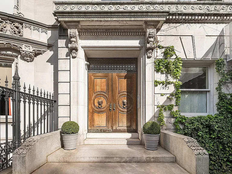 fifth ave nyc mansion listed for $58 million, exterior of 973 fifth avenue with massive rood deck facing central parkfifth ave nyc mansion listed for $58 million, exterior of 973 Fifth Avenue in NYC with massive wooden front door