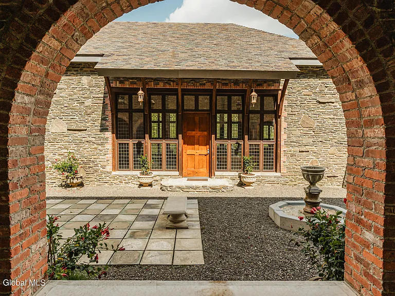 massive catskills ny castle for sale in sullivan county, stone and brick exterior archways