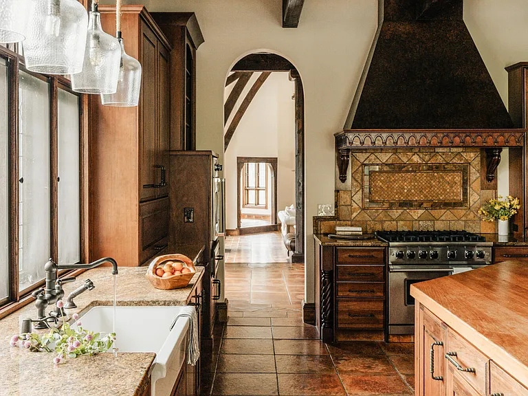 massive catskills ny castle for sale in sullivan county, tudor style kitchen with farmhouse sink and arched doorways