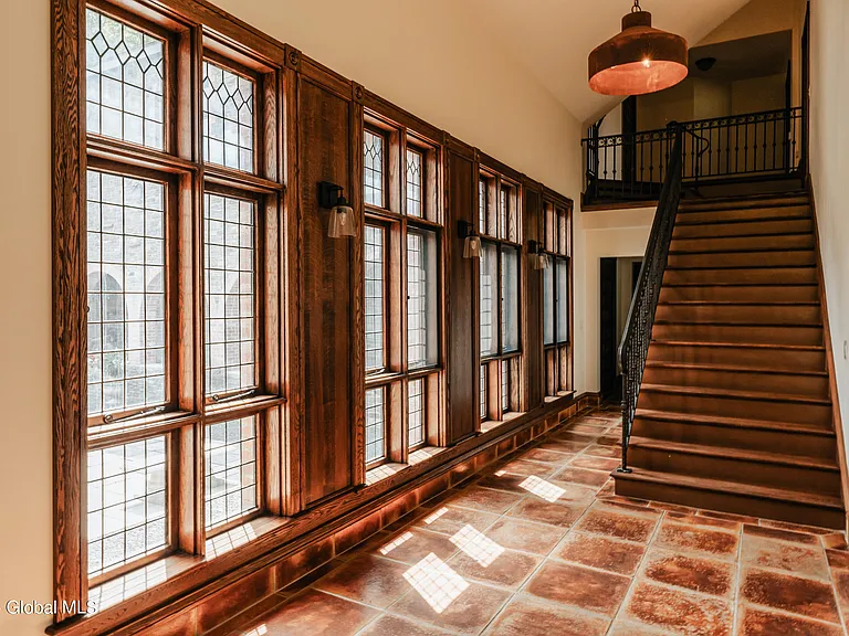 massive catskills ny castle for sale in sullivan county, tudor style kitchen with farmhouse sink and arched doorways