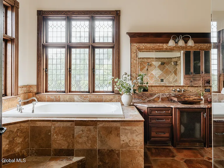 massive catskills ny castle for sale in sullivan county, tudor style master bathroom with tuscan tile