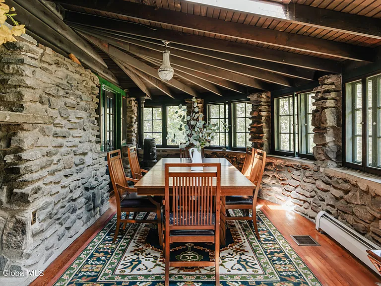 massive catskills ny castle for sale in sullivan county, stone guest house in wurstsboro with semi outdoor stone dining room