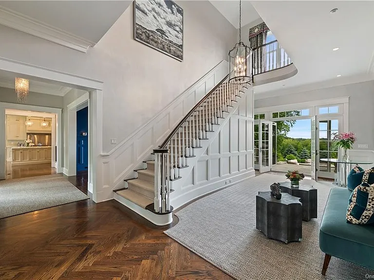 Westchester Mansion, interior of Happy Hill Farms in Bedford Corners New York with massive white wood staircase