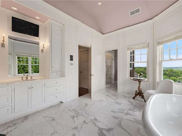 Westchester Mansion, interior of Happy Hill Farms in Bedford Corners New York with massive master bathroom with soaking tub and pink tray ceiling