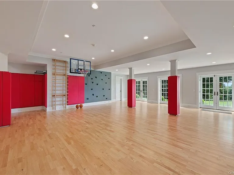 Westchester Mansion, interior of Happy Hill Farms in Bedford Corners New York with a massive indoor private basketball court