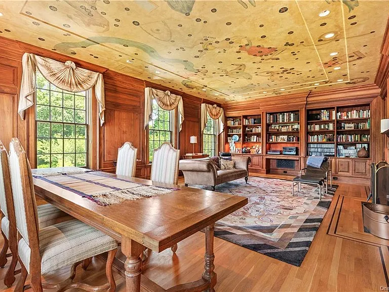 eclectic castle in new york, interior of the Salutation Castle replica with antique victorian era living room and dining space