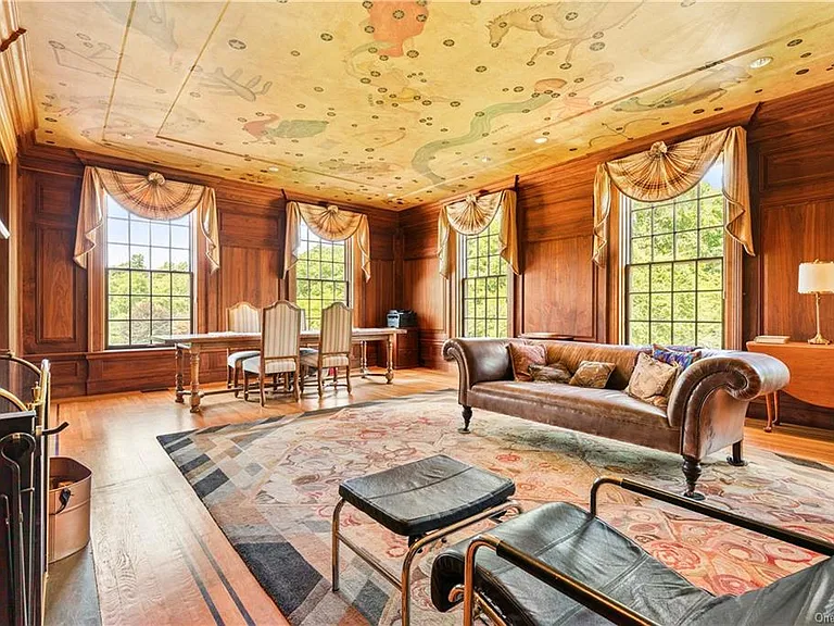 eclectic castle in new york, interior of the Salutation Castle replica with antique victorian era living room and dining space with hand painted ceilings