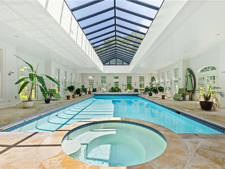 eclectic castle in new york, interior of the Salutation Castle replica with massive indoor pool and vaulted sun ceilings