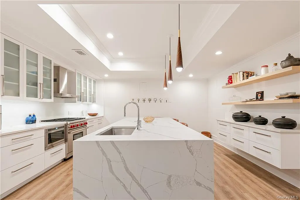 eclectic castle in new york, interior of the Salutation Castle replica with massive guest kitchen encased in white marble