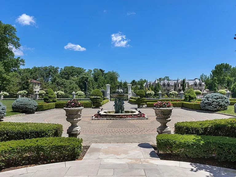 maximalist NJ mansion, 12 The Esplanade in Alpine New Jersey exterior gates and massive driveway