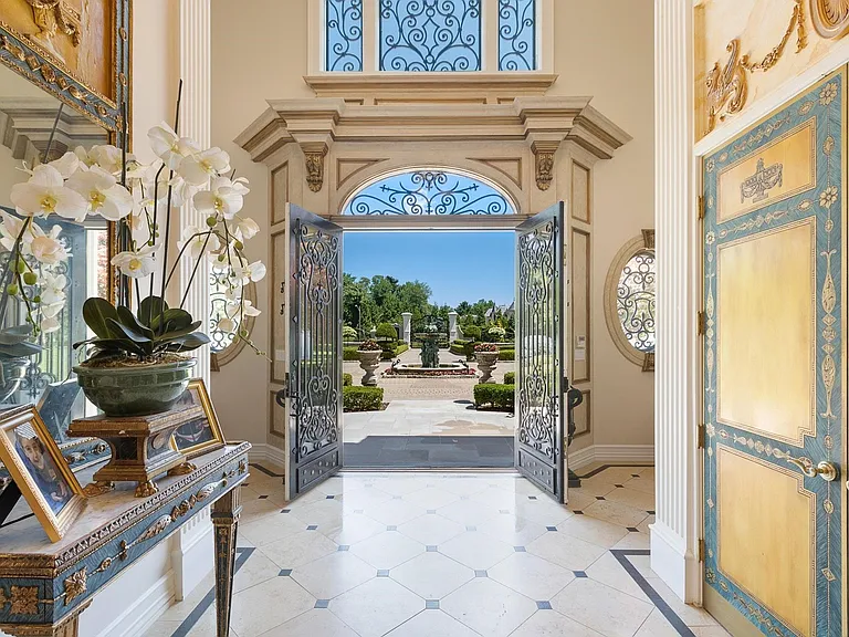 maximalist NJ mansion, 12 The Esplanade in Alpine New Jersey interior marble foyer with greek columns