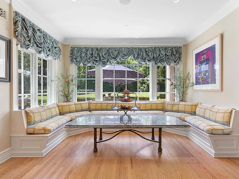 maximalist NJ mansion, 12 The Esplanade in Alpine New Jersey interior dining space with banquette seating